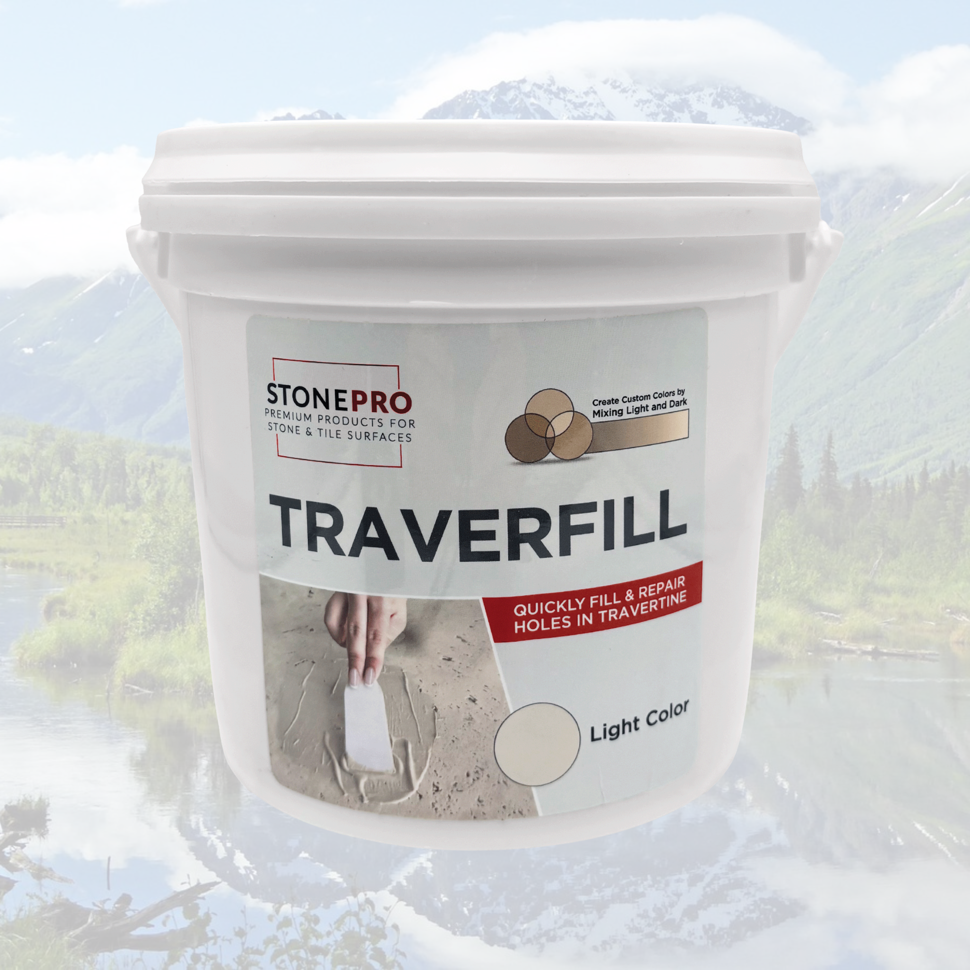 A white plastic bucket of StonePro Traverfill repair mortar, shown against a faded background of a mountain landscape. The label features the StonePro brand name, the product name 'TRAVERFILL', and a color swatch indicating 'Light Color'.